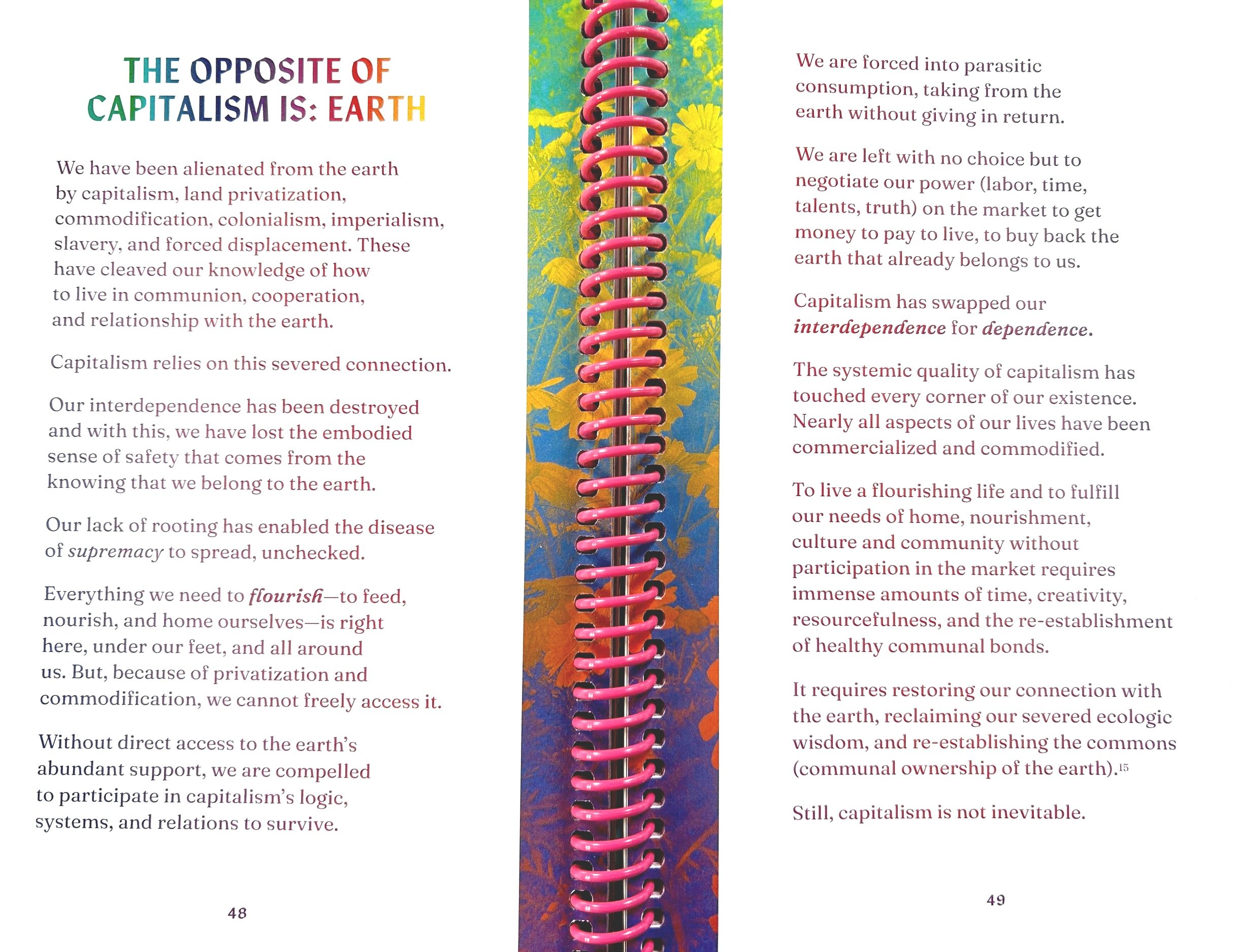 an open spread of a book with a pink plastic spiral binding and a header that says The Opposite of Capitalism Is: Earth
