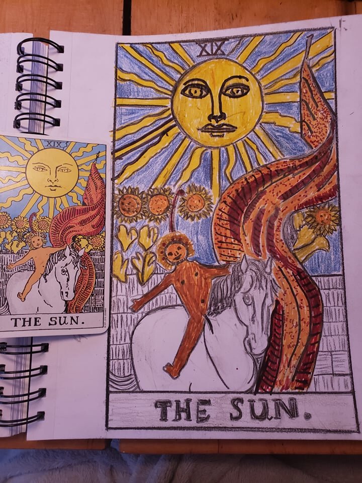 a tarot card next to a larger notebook page where the image from that tarot card has been hand-drawn