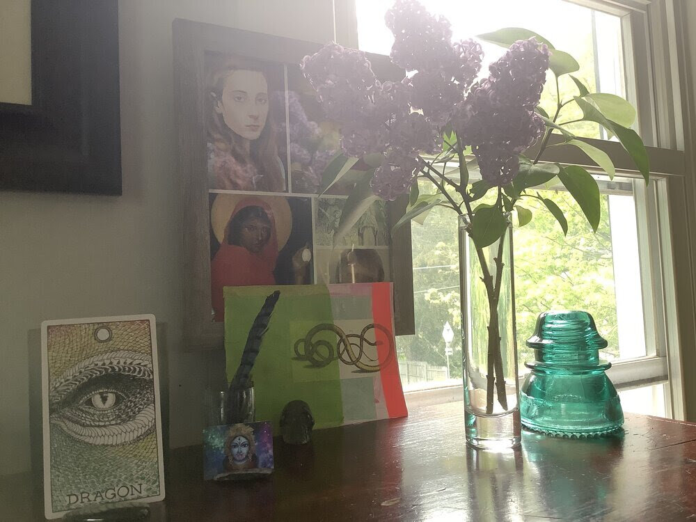   The last of the season’s lilacs offering up their magical perfume. Art postcard by    Robyn Love   . Dragon card from the    Wild Unknown Animal Spirit deck   . Plus Jeanne d’Arc, Mary Magdalene and Kali Ma. Turquoise blue glass insulator from my Daddy-o, Wayne.  