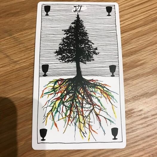 line drawing of a black coniferous tree against thin black horizontal lines while below a tangle of colorful roots spreads into white space